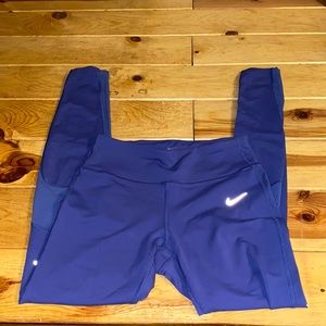 Nike dry fit purple leggings, zipper pocket in the back, mesh breathing patches